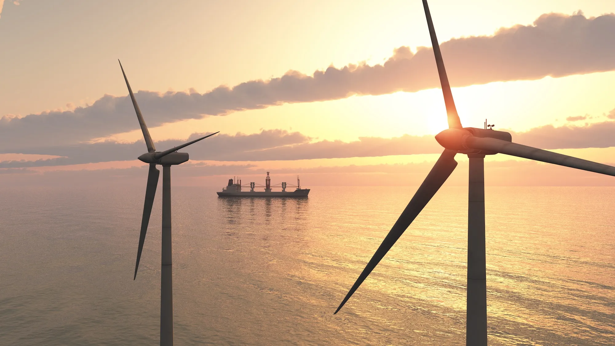Wind turbines in the open sea at sunset